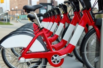 A row of red rental bicycles.