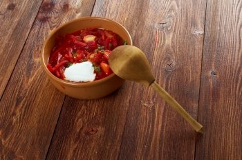 ukrainian and russian red-beet soup (borscht) with garlic and sour cream.farm-style  