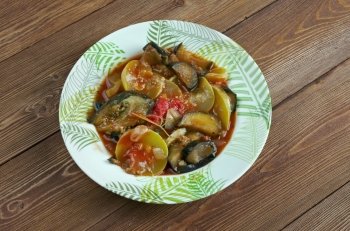 Briami  - Greek Ratatouille.Baked Vegetables with eggplant, paprika and tomato.