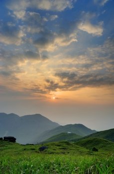 Sunrise from the Sunset Peak, Hong Kong. The grass in the front.
