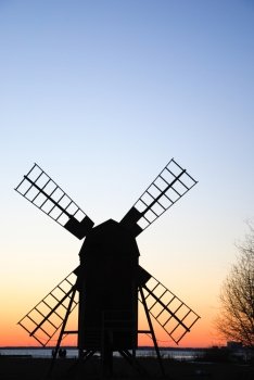 Sillhouette of an old traditional windmill by the coast of the swedish island Oland