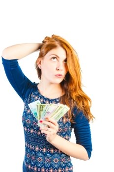beautiful woman posing on a white background with money