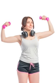 Vertical picture fitness instructor with dumbbells and headphones