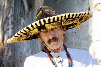 mexican man with sombrero posing outdoor