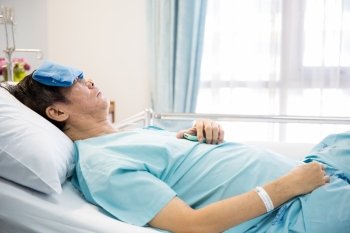 mature senior man Patient sleeping in hospital bed