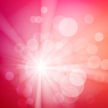 Abstract bokeh sparkles on pink blurred background