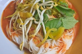 Thai vermicelli eaten with curry and vegetable close up    