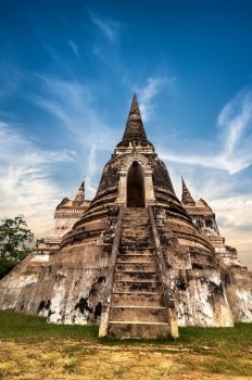 Asian religious architecture. Ancient Buddhist pagoda ruins at Wat Phra Sri Sanphet temple under sunset sky. Ayutthaya, Thailand travel landscape and destinations