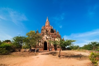 Seinnyet Ama Temple under blue sky. Amazing architecture of old Buddhist Temples at Bagan Kingdom, Myanmar (Burma) travel landscapes and destinations