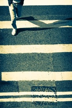 Pedestrians people moving at zebra crosswalk. Hong Kong. Crowded city abstract background in vintage style