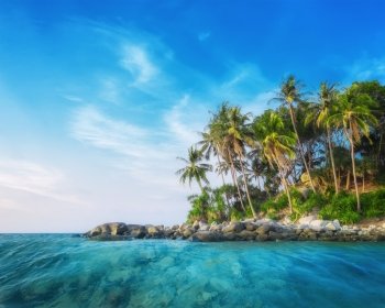 Ocean landscape with palm trees at tropical island under blue sky. Thailand travel landscapes and destinations