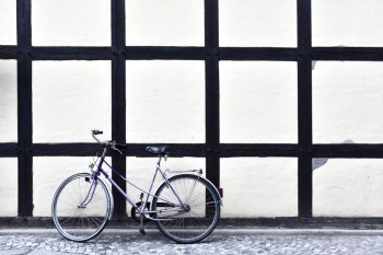 Lonely bicycle near wall, Germany