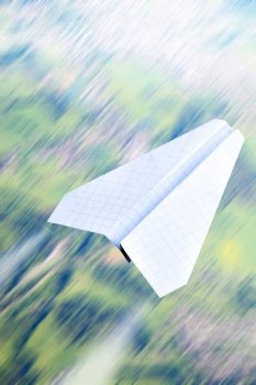Aerial view in motion blur and paper plane
