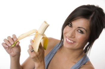 Fruit Lover Attractive Woman Peels Banana Raw Food. Beautiful Brunette holds a Banana