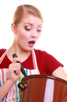Surprised shocked emotional housewife or chef in colorful kitchen apron with pot of soup and ladle isolated studio shot