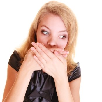 surprised woman shocked buisnesswoman in black dress covers mouth with hand isolated on white