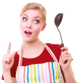 Funny housewife or cook chef in colorful kitchen apron with ladle isolated studio shot