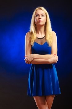 Party, new year, celebration, disco concept - alluring fashion woman, blonde long hair girl in evening dress night club dark blue background