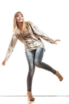Fashion. Attractive blonde fashionable woman jeans pants bright sleeve shirt. Female model posing isolated studio shot