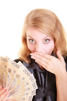 Surprised business woman holding polish currency money banknote and covering her mouth with hand. Finance savings concept.
