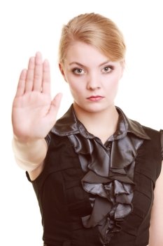 Portrait of serious businesswoman blonde businesswoman in black showing no stop hand sign gesture isolated on white.