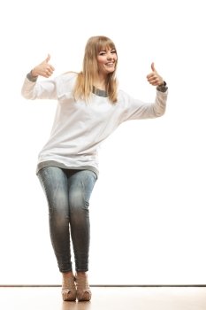 Fashion happiness concept. Full length happy woman jeans pants white long-sleeved shirt making thumb up hand sign gesture isolated