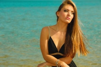 Holidays, vacation travel and freedom concept. Beautiful sexy girl on beach. Young pretty woman relaxing on the sea coast.