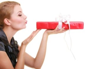 Holidays love and happiness concept - beautiful blonde girl with red gift box blowing a kiss isolated