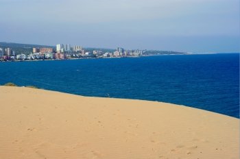 sand, sea and town; turkish beach near Adana