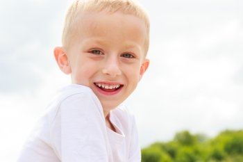 Portrait of smiling child kid outdoor. Happy childhood.. Happy smiling child kid outdoor.