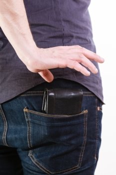 Closeup. Thief stealing wallet from back pocket of careless man. Risk of theft. Isolated on white. Studio shot.