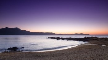 Purple sunset over Calvi and Revellata from Arinella Plage in Corsica